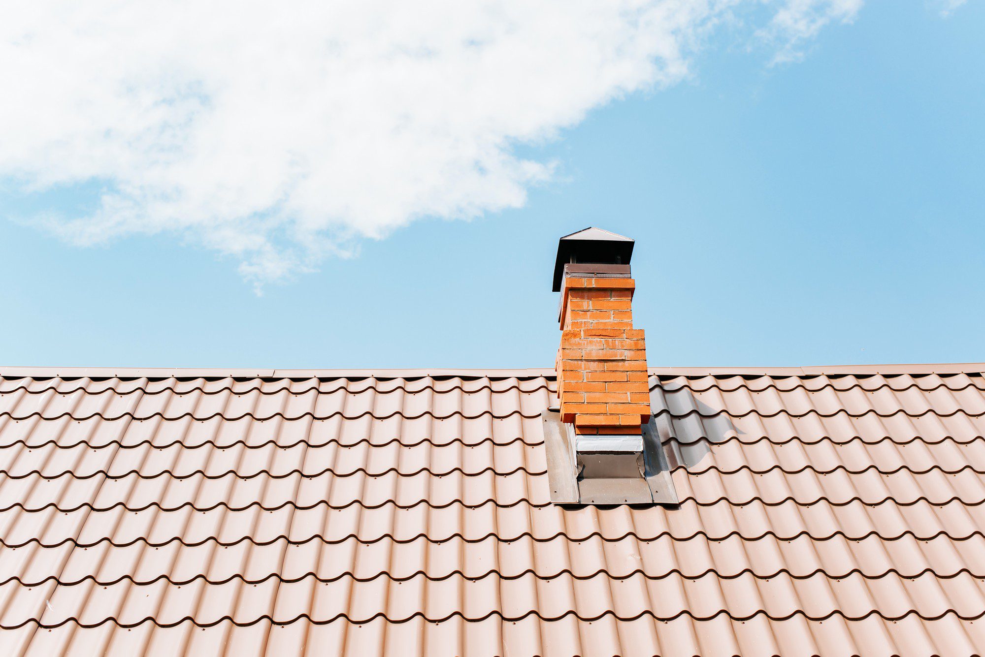 Tiled Roof Of A House With A Brick Chimney Against 2022 06 08 16 15 00 Utc